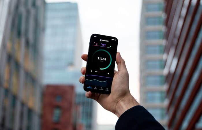 a person holding a cell phone in their hand